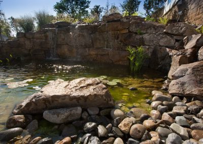 Natural boulder waterfall and pond water feature by Frederick Landscaping Maryland