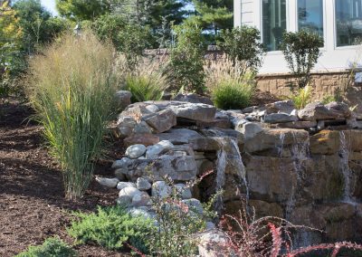 Natural boulder waterfall and water feature by Frederick Landscaping Maryland
