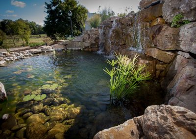 Natural boulder waterfall and pond by Frederick Landscaping Maryland